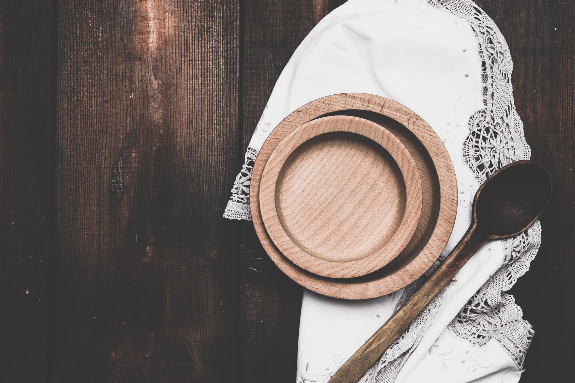 Chef arranging artisanal dish on wooden plate